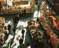 Overhead view of grocery store aisle with shoppers and stocked shelves