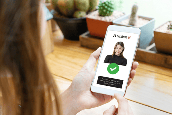 Alcatraz AI smartphone facial recognition app showing verified face with green checkmark