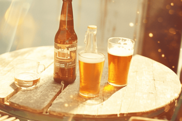 Analog film photo of beer glasses on a sunlit table