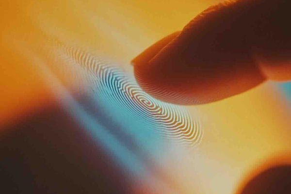 Abstract illustration of a fingerprint with concentric blue rings depicting biometric sensor technology