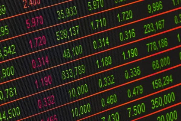Stock market ticker display with red and green financial data numbers