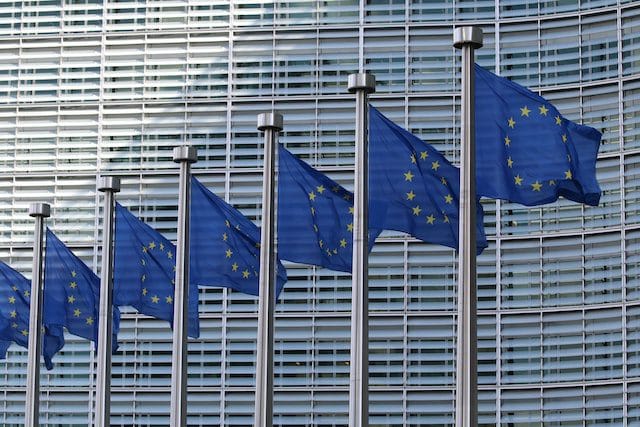 European Union flags in front of office building